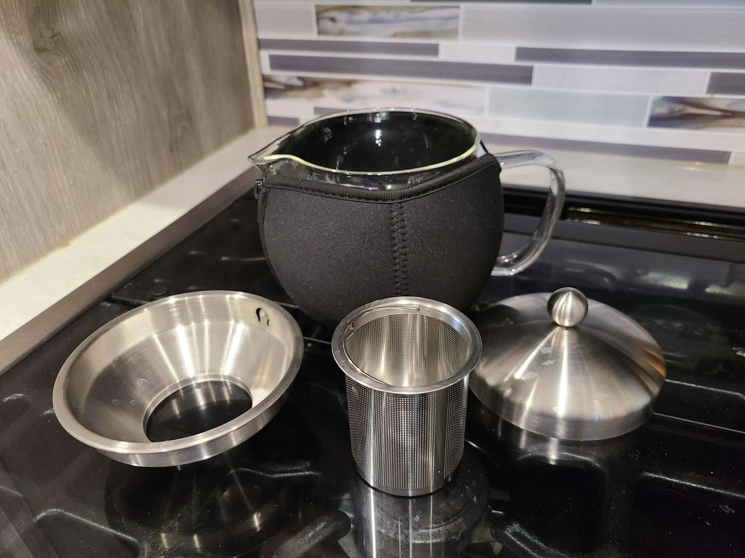 Willow and Everett Glass tea kettle infuser on stove shown with accessories taken apart
