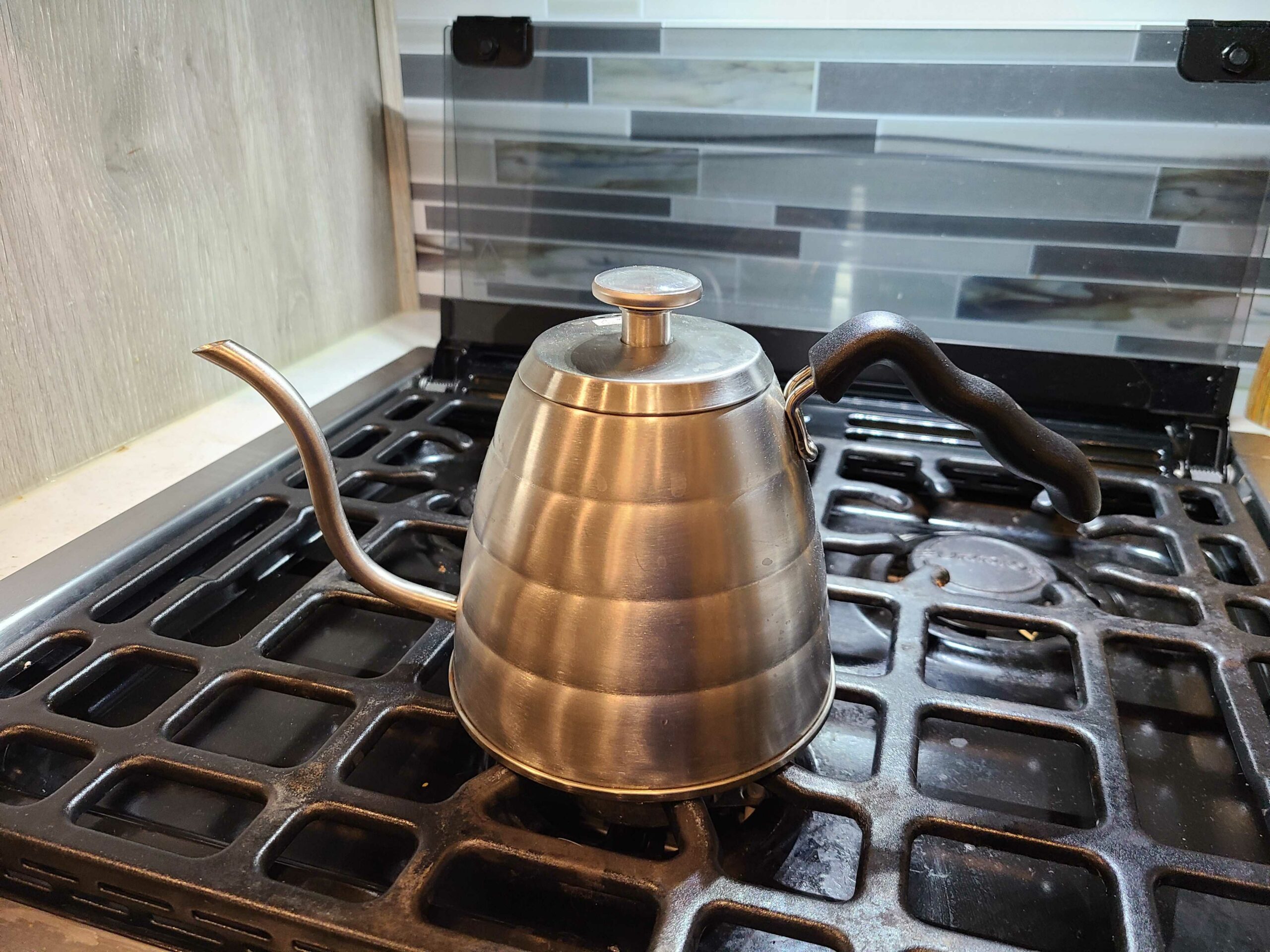 stainless steel gooseneck kettle on stove