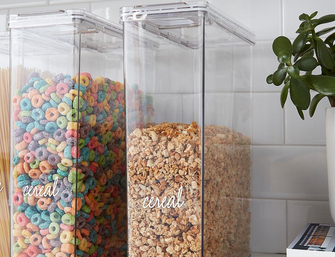 two acrylic cereal containers on counter