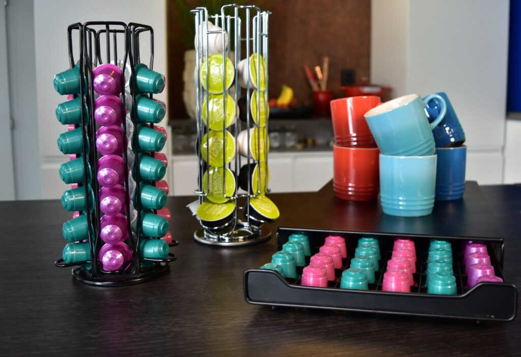 several different storage racks for coffee pods