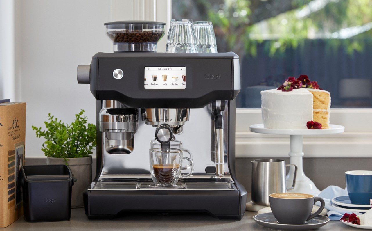 Countertop Barista style espresso machine styled with coffee pots and desserts