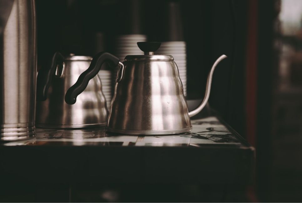 stylized image of stainless steel gooseneck tea kettles