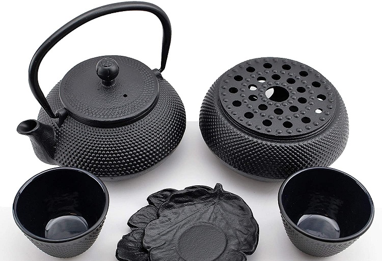 black cast iron teapot and accessories