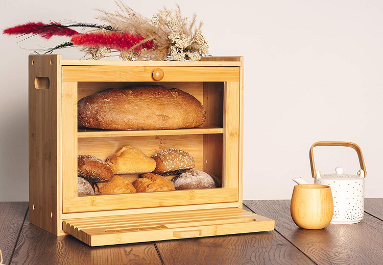 large wooden bread box styled with loaves of bread