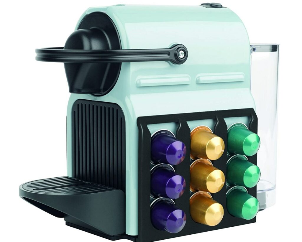 mint green coffee pod machine with built in rack holding pods