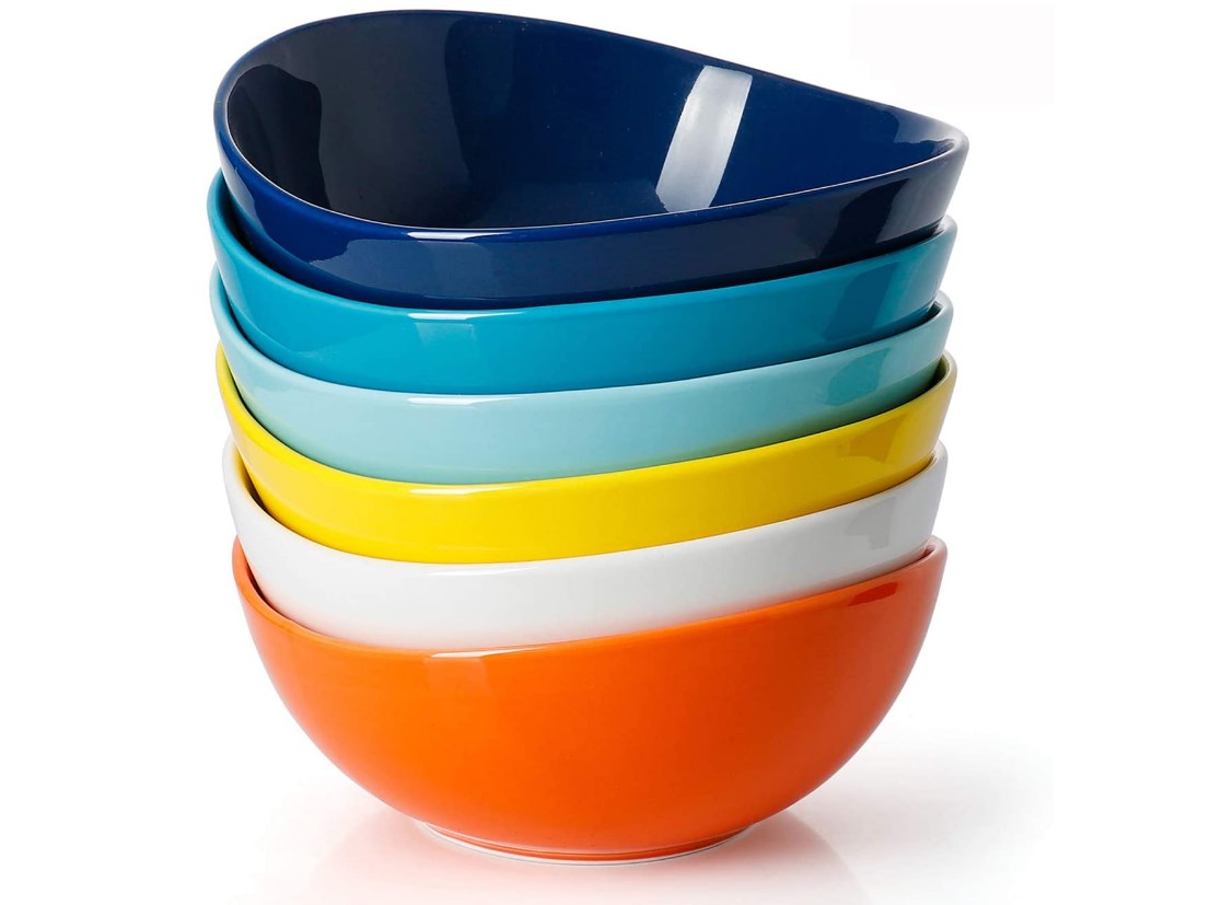 stack of bright multicolored cereal bowls with wavy edge