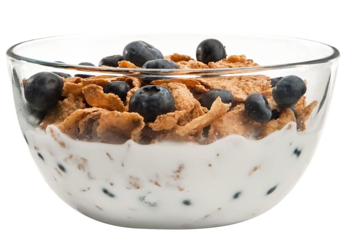 cereal with blueberries in glass bowl