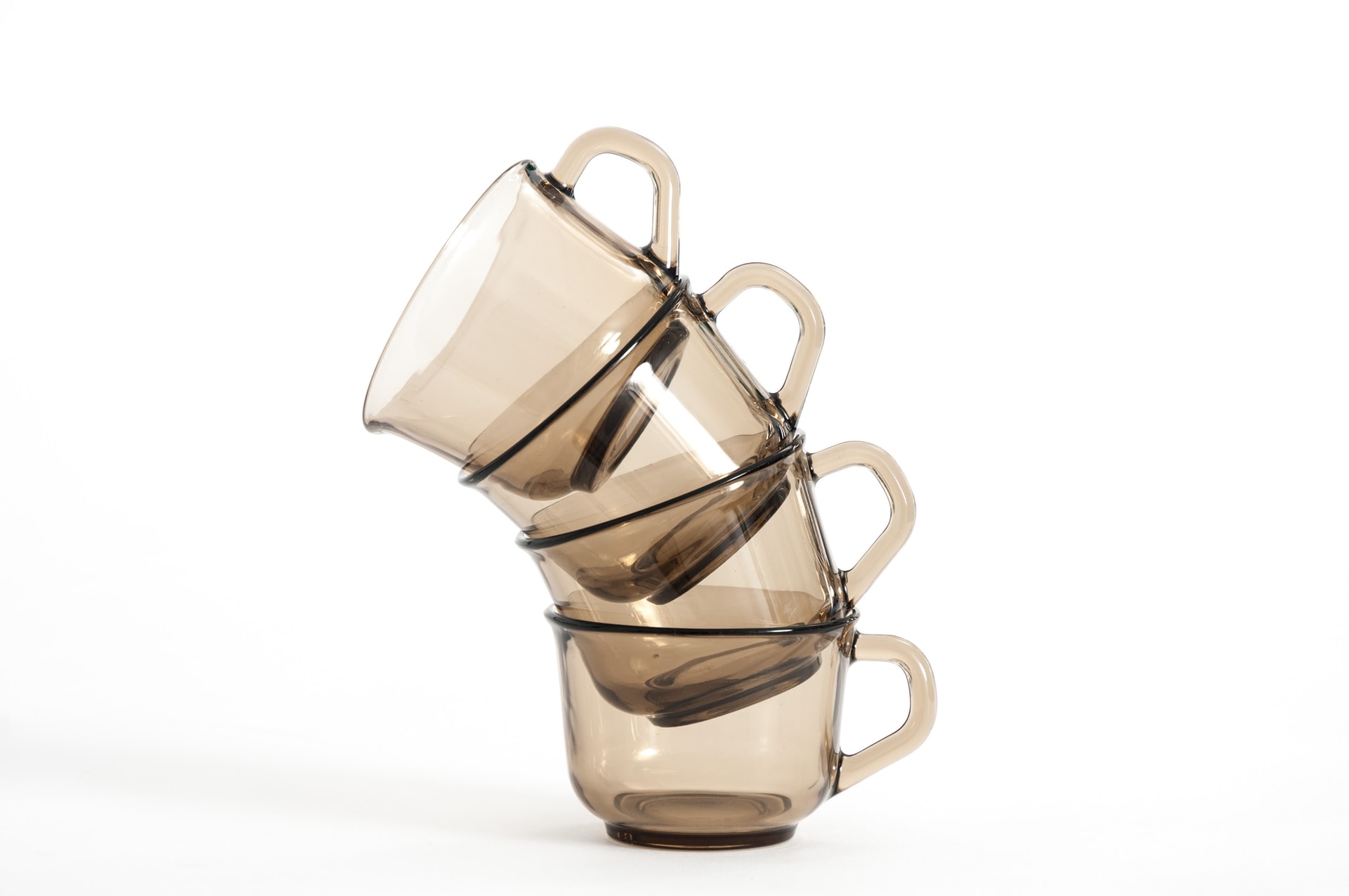 stack of amber glass coffee mugs