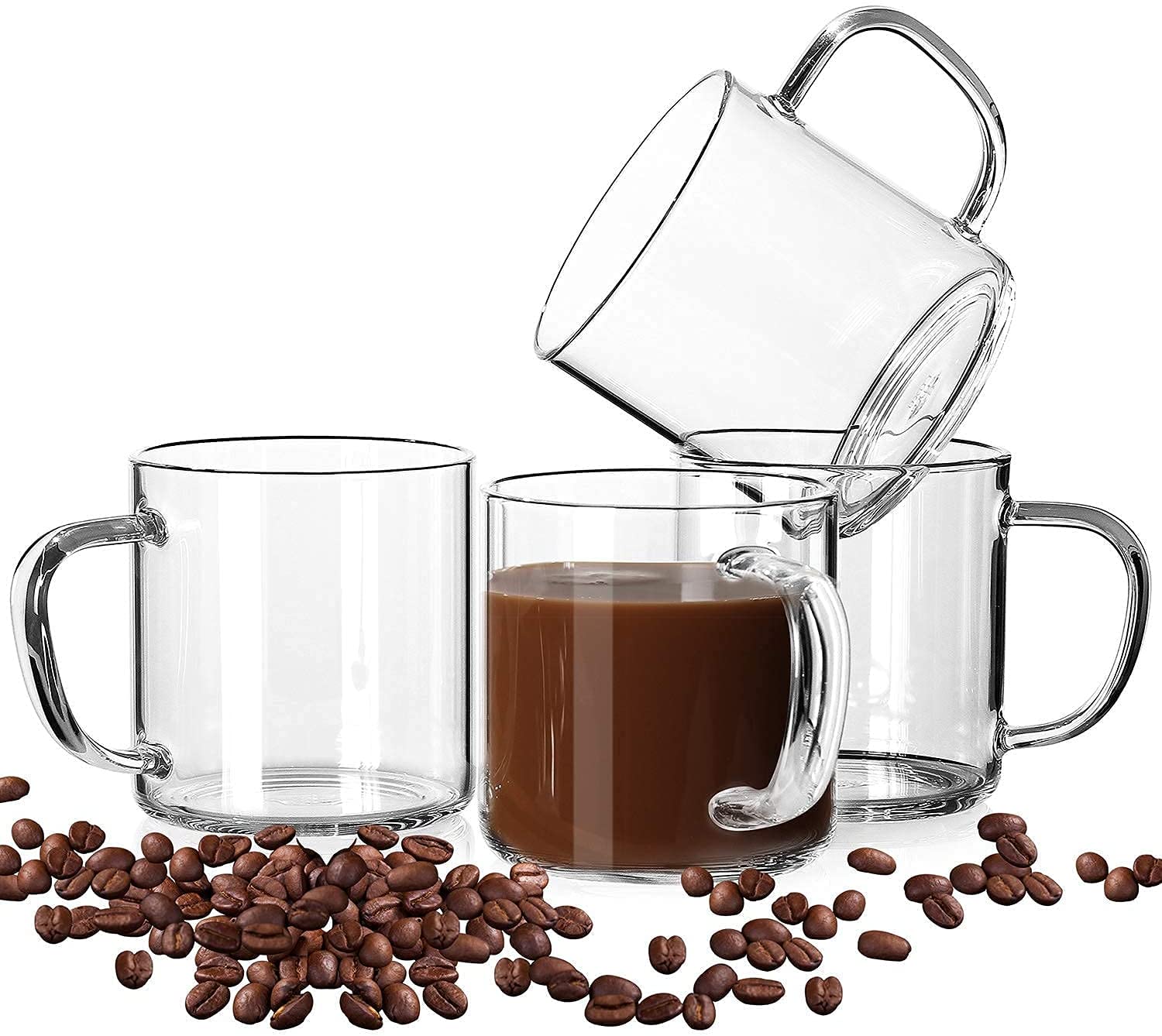 glass coffee mug full of coffee styled with empty glass mugs and coffee beans