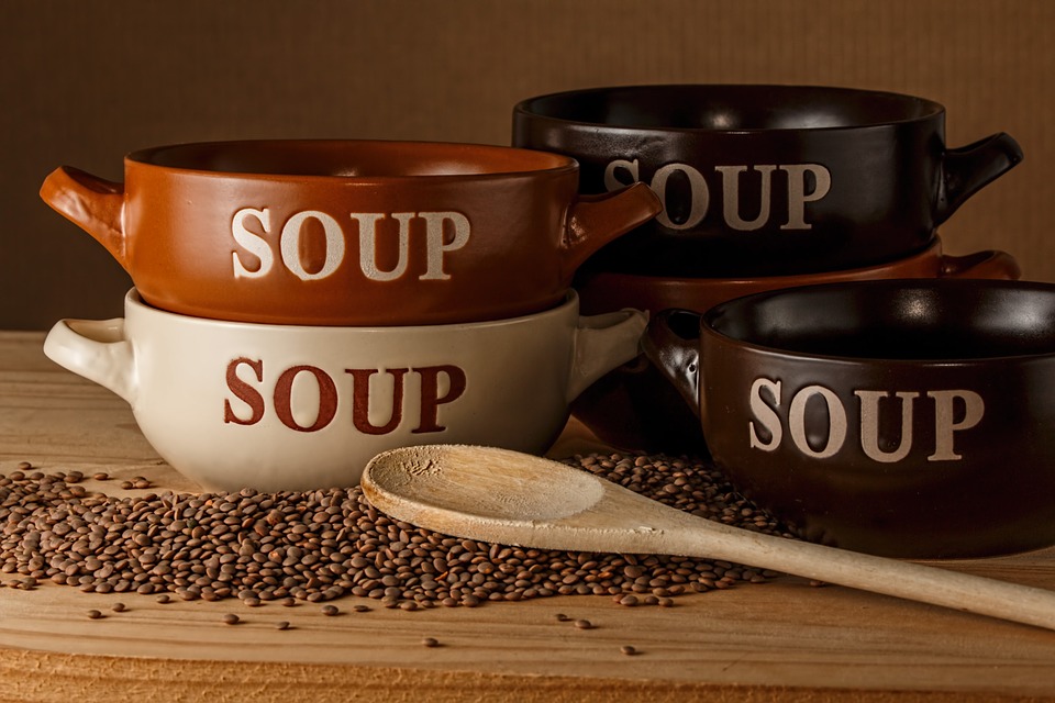 labeled soup bowls with handles styled over lentils