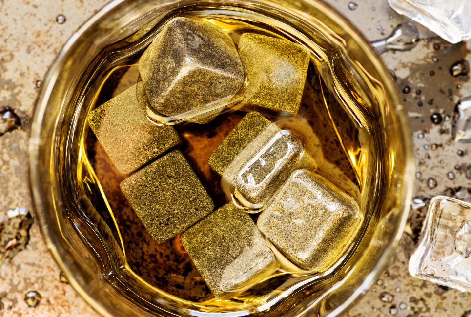 grey square whiskey stones in glass of whiskey