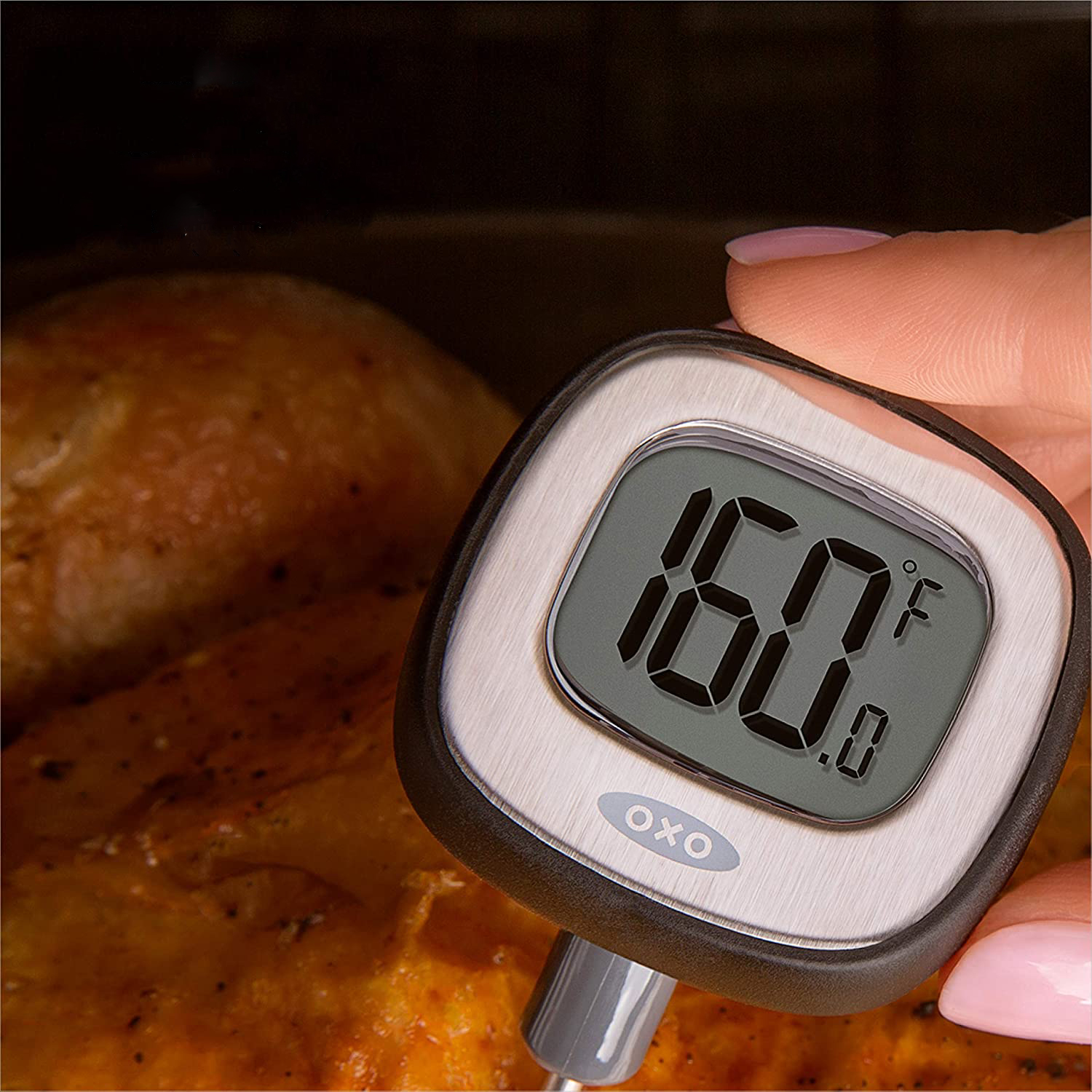 digital meat thermometer showing 160 degrees