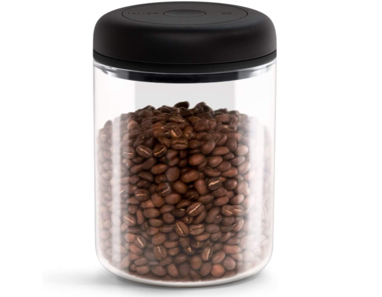 coffee beans in clear canister and black lid