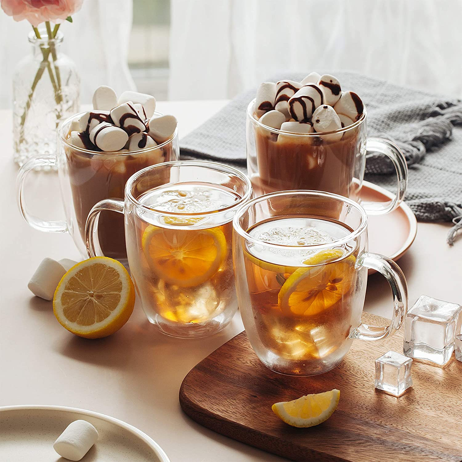 hot chocolate and tea with lemon steeping in glass mugs