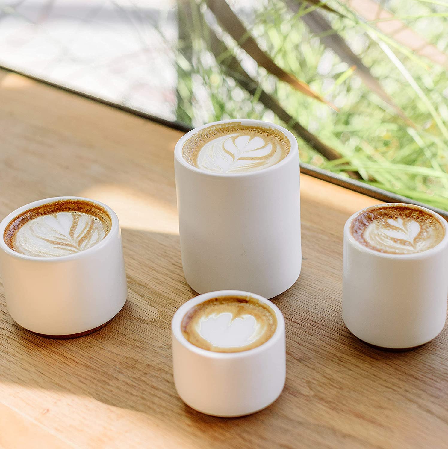 latte art in white mugs