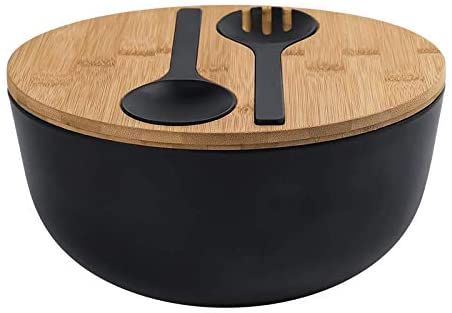 black salad bowl with wooden lid holding utensils